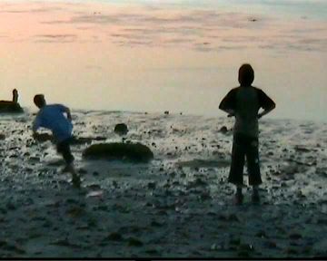 Am Strand in der Sonnendmmerung